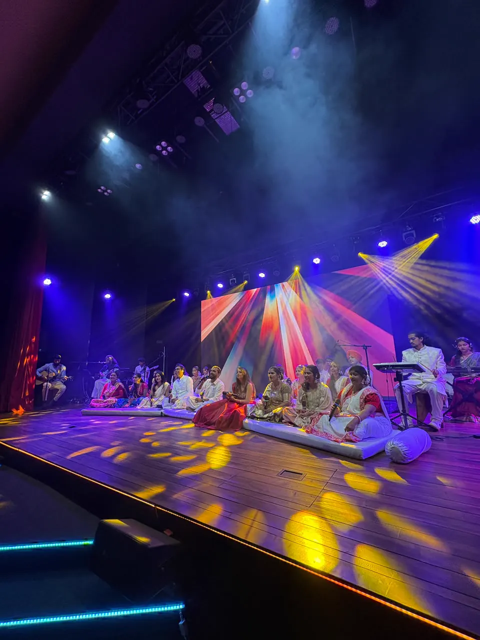 The Cultural Sunday stage illuminated in colour.